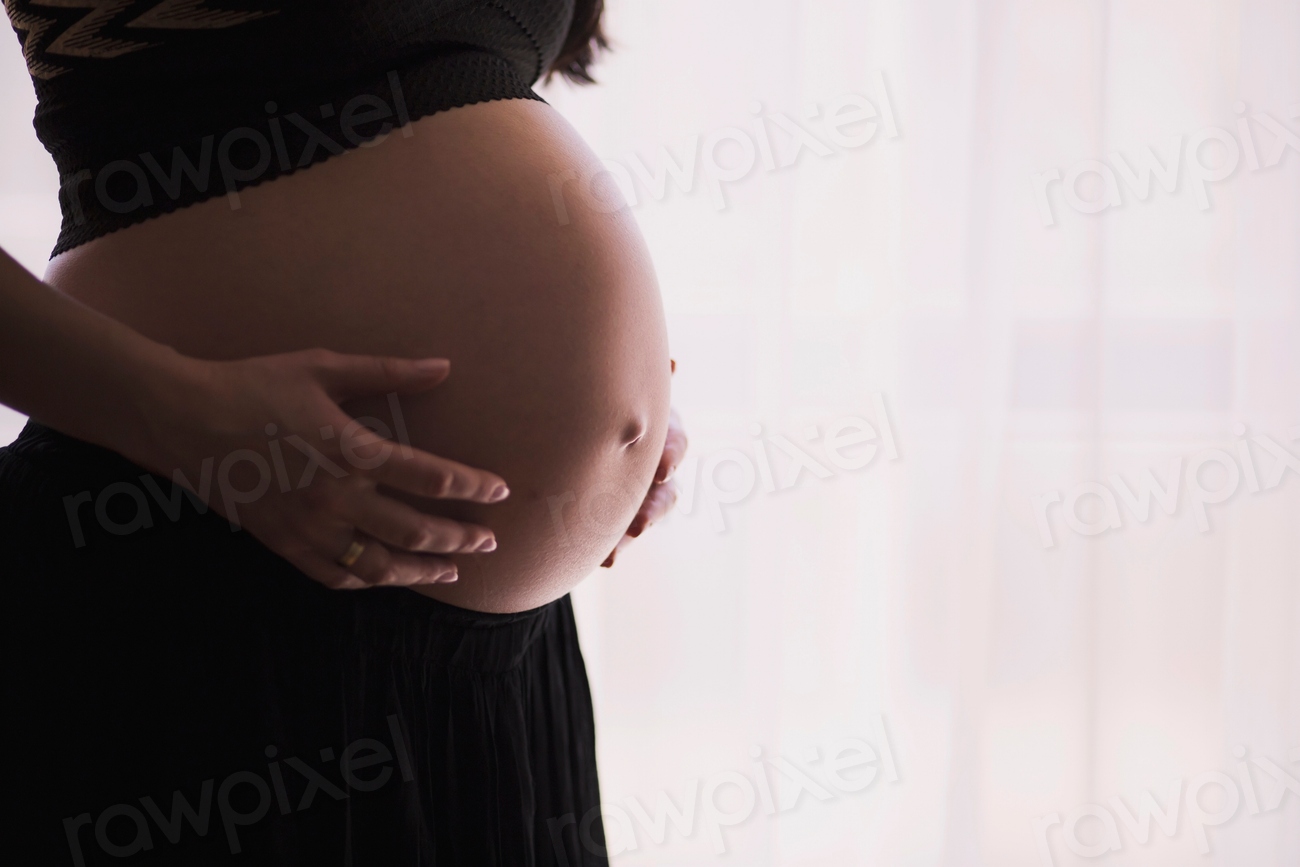 Pregnant woman black holds her
